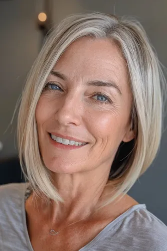 Try on a stylish short blonde hairstyle, featuring sleek, chin-length layers that beautifully frame the face.