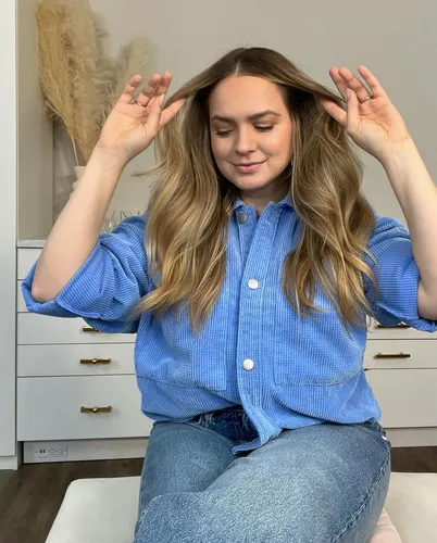 Try on this long, wavy hairstyle perfect for a casual yet stylish look.