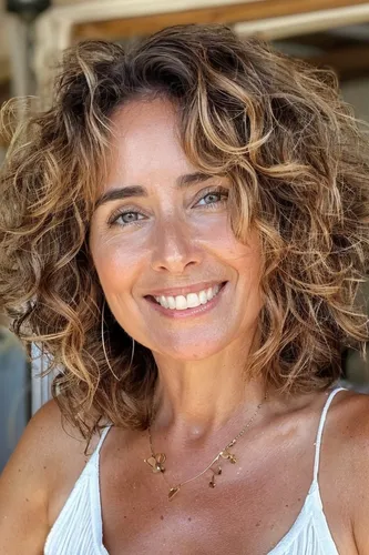 Try on a hairstyle featuring shoulder-length, curly hair with natural highlights.