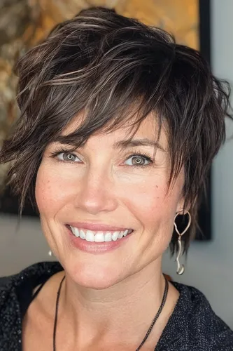 Try on a trendy short wavy hairstyle with textured layers adding volume and movement
