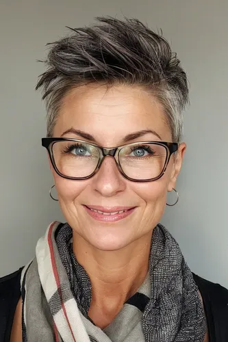 Try on this trendy short, textured hairstyle featuring layered strands with a dynamic, choppy look that adds a youthful edge.