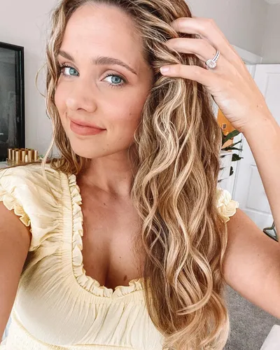 Try on this wavy hairstyle featuring long and voluminous curls