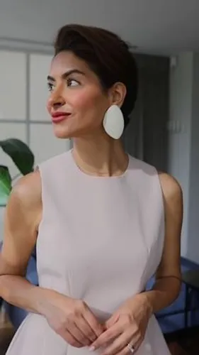 Try on this elegant updo hairstyle, featuring neatly pulled back hair enhancing the facial features.