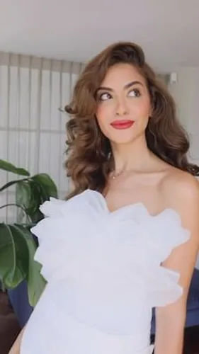 Try on this elegant medium length wavy hairstyle