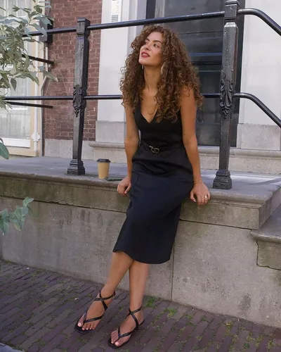 Try on a voluminous, curly long hairstyle with bouncy curls that add a playful yet glamorous touch to any look.
