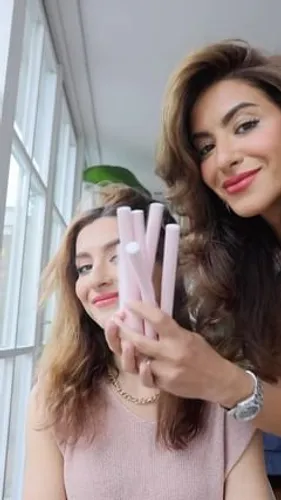 Try on a wavy, brown hairstyle with varied light tones and highlights