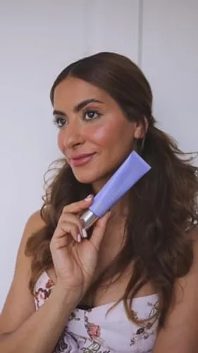 try on a wavy hairstyle, visible on a person with their face obscured, highlighting the styled, voluminous waves