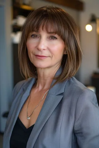 Try on a stylish medium length straight hairstyle with subtle layers.