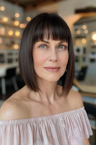 Try on this sleek and straight bob cut with evenly trimmed bangs that complement the style beautifully.