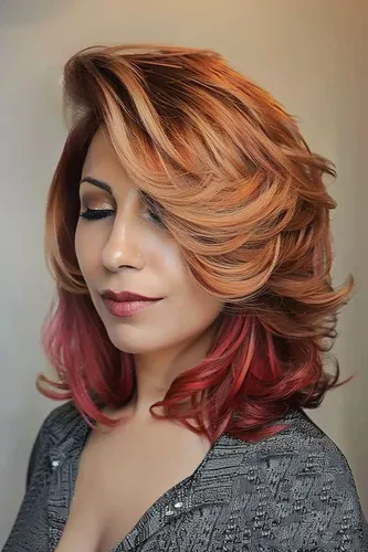 Try on this glamorous hairstyle featuring rich, multi-tonal colors blending from golden blonde to vibrant red. The style is a cascade of soft, voluminous waves intricately layered for a dynamic look.