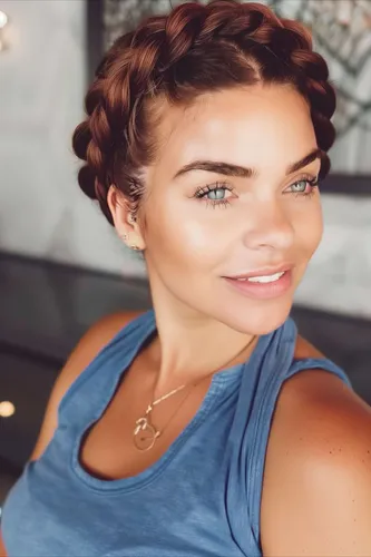 Try on this elegant braided hairstyle that wraps around the head in a crown-like fashion, featuring thick, neatly styled braids that enhance the hair's rich, dimensional color.