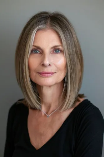 Try on a medium-length straight hairstyle with subtle layers framing the face, adding a elegant and refined look.