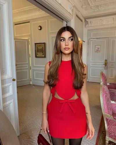 try on a stylish long, wavy hairstyle as shown by the person in the image