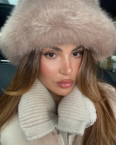 Try on straight long hairstyle, featuring sleek, flowing strands extending down from a soft pink fur hat.