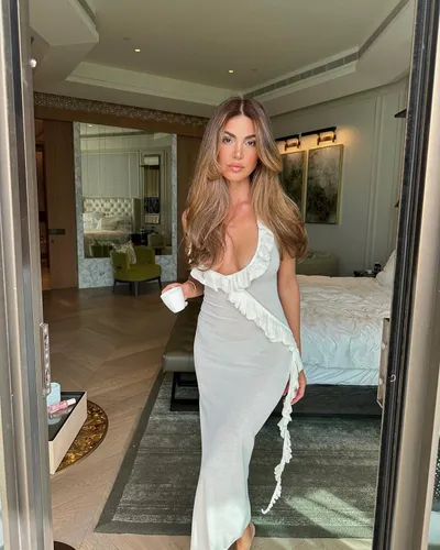 Try on this long, wavy hairstyle as demonstrated by the woman