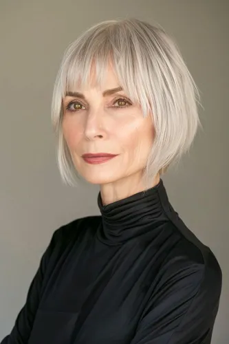 Try on this sleek blonde short hairstyle with layers gently framing the face, exuding a modern and sophisticated vibe.