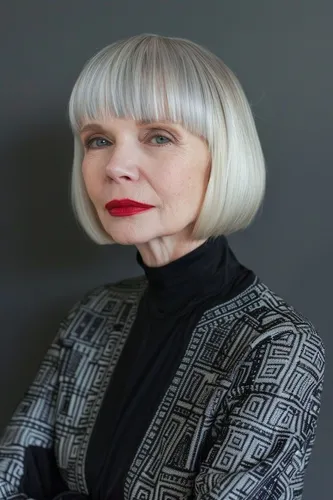 Try on this sleek and elegant bob cut with full bangs in platinum blonde. The hairstyle provides a smooth, chic look, perfect for showcasing a poised and refined style.