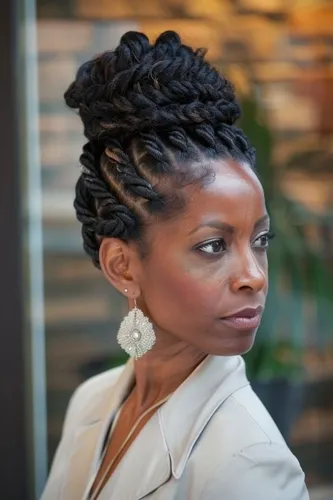 Try on a braided updo hairstyle, intricately styled with multiple braids winding and coiling atop the head, offering a sophisticated and elegant appearance.