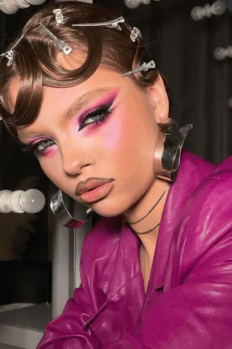 Try on a unique pinned curls hairstyle featuring small sections of hair pinned close to the scalp with metal clips
