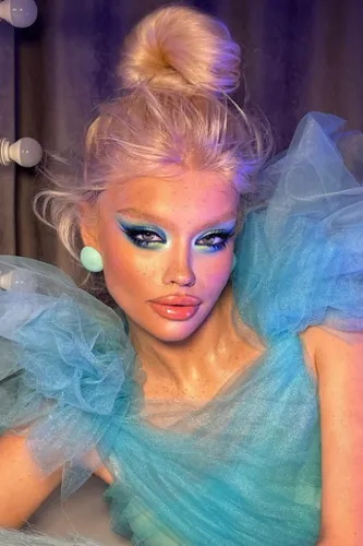 Try on this chic high bun hairstyle, elegantly twisted atop the head, adding a touch of classical beauty to your look.
