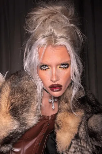 try on a voluminous and messy updo hairstyle with platinum blonde color