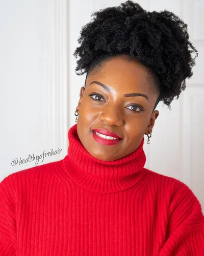 Try on this hairstyle: a curly updo adds a stylish touch to this image