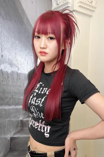 Try on this vibrant red high ponytail hairstyle featuring long layers