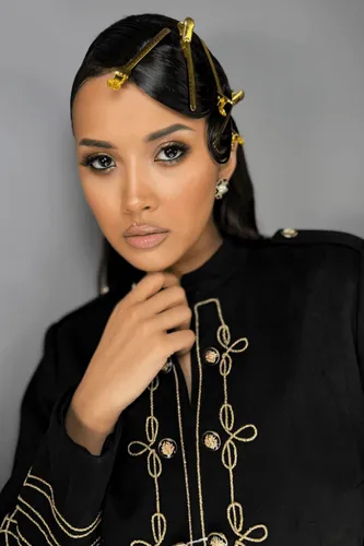 Try on this elegant slicked-back hairstyle, neatly secured and highlighted with golden hair clips placed creatively throughout.