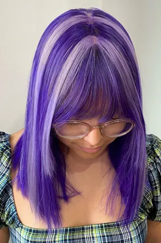 Try on this vibrant straight purple hairstyle.