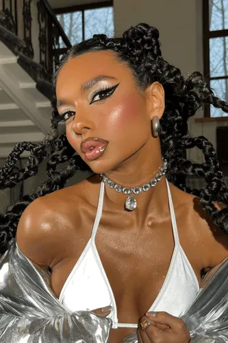 Try on this unique braided hairstyle featuring multiple small braids that converge into larger twists, providing a dynamic and intricate look.