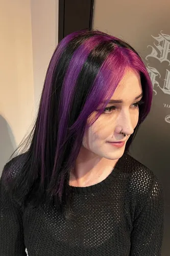Try on this hairstyle featuring long straight hair with vibrant purple highlights, offering a bold and dynamic look.