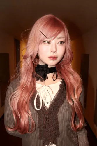 Try on this long, wavy pink hairstyle that flows elegantly over the shoulders.
