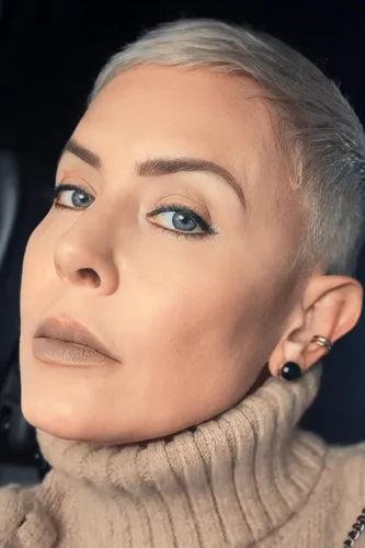 Try on a short, neatly trimmed buzz cut hairstyle. The look showcases finely cropped, almost skin-close hair that accentuates the face's shape beautifully.