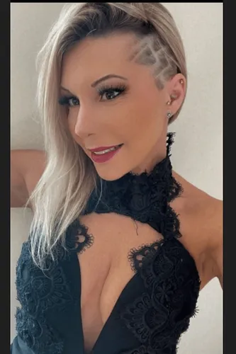 Try on a unique hairstyle featuring a combination of shaved side patterns and long flowing locks on the opposite side, presenting a bold and edgy look.