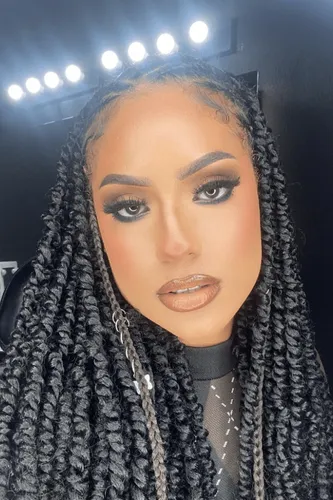 Try on this hairstyle featuring chunky twist braids, adorned with minimal accessories