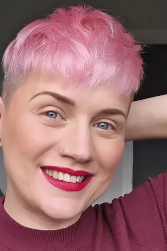 Try on a vibrant pink, short hairstyle with light texturing and a playful vibe.