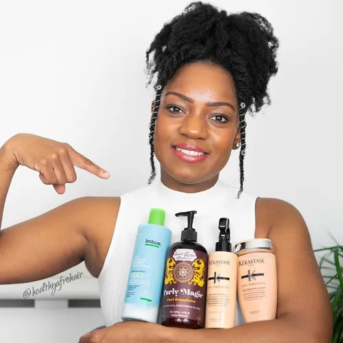 Try on a twist-out hairstyle, where the hair is sectioned, twisted, and styled to create defined curls, as shown on a woman with neatly styled sections partially framing her face.