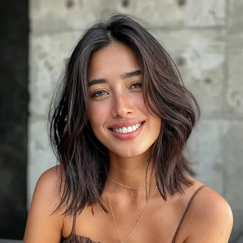 Try on this trendy medium length, wavy hairstyle that appears both effortless and stylish, adding a charming vibe.