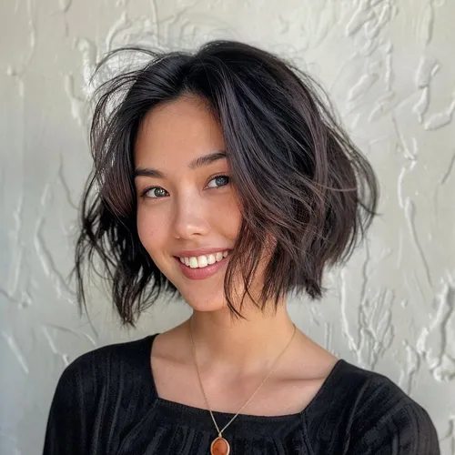 Try on this stylish short, wavy hairstyle that frames the face beautifully, enhancing a cheerful and youthful appearance.