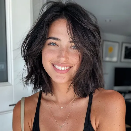 Try on this carefree, dark-colored messy bob hairstyle