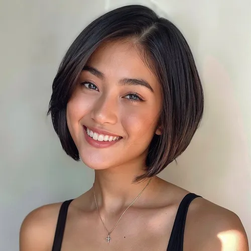 Try on this chic short bob haircut, styled with a natural, side-parted look that frames the face beautifully.