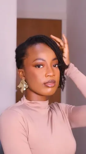 Try on this curly hairstyle, featuring medium-length curls partially pulled back, giving a casual yet styled look.