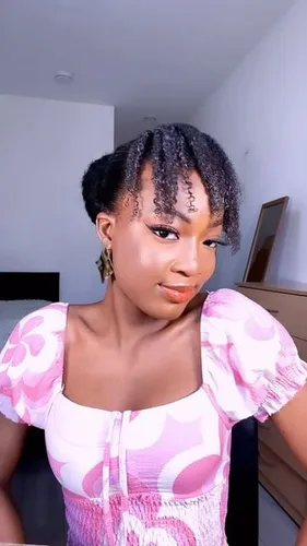 Try on this hairstyle featuring short, intricately braided hair, with some braids hanging delicately beside the face adding a charming aesthetic.
