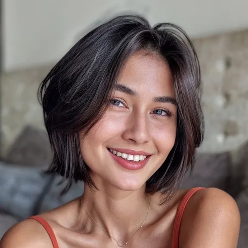 Try on a trendy short layered hairstyle featuring a dynamic mix of lengths that create a voluminous and textured look.