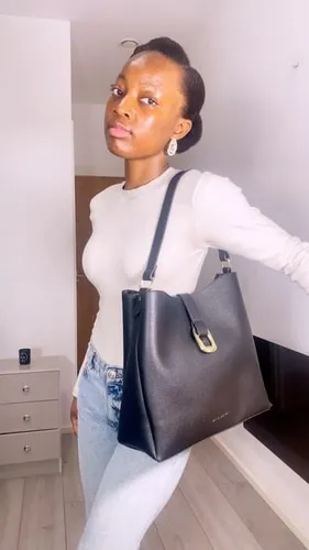 Try on this slicked-back ponytail hairstyle, showcasing a neat and elegant look perfect for both casual and formal settings.