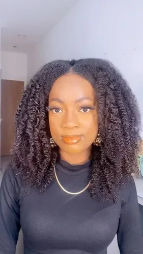 Try on a hairstyle featuring shoulder-length, tightly coiled curls that frame the face beautifully.