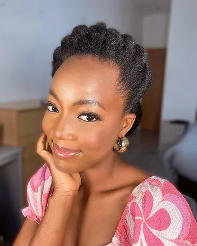 Try on a twisted updo hairstyle with neatly arranged sections adding volume to the crown