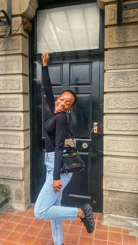 Try on a joyful pose with short hair styled naturally, adding a playful and cheerful vibe.