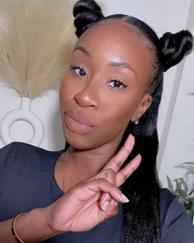 Try on a playful double buns hairstyle with smooth, shiny texture, giving a youthful and fun vibe suitable for casual occasions.