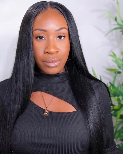 Try on a sleek straight hairstyle. The hair appears well-maintained, smooth, and flowing down past the shoulders, enhancing a sophisticated look.